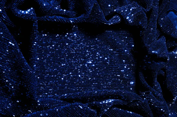  ile mavi kumaş. Göz alıcı bir ilişki için bu mavi maske spor. Dairesel çocuk sparkles yoğun bir düzenleme tüm kaplama için düz örgü gücü kapsamında kalır