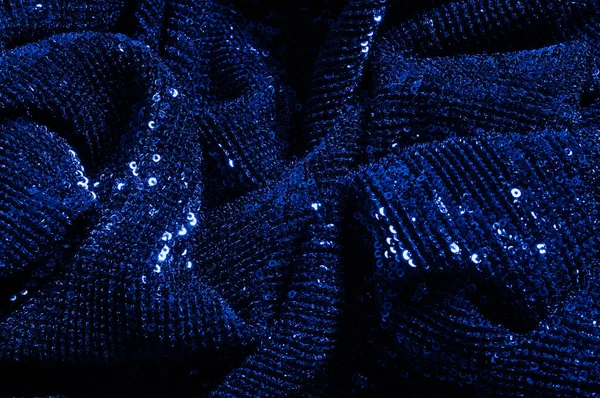  ile mavi kumaş. Göz alıcı bir ilişki için bu mavi maske spor. Dairesel çocuk sparkles yoğun bir düzenleme tüm kaplama için düz örgü gücü kapsamında kalır