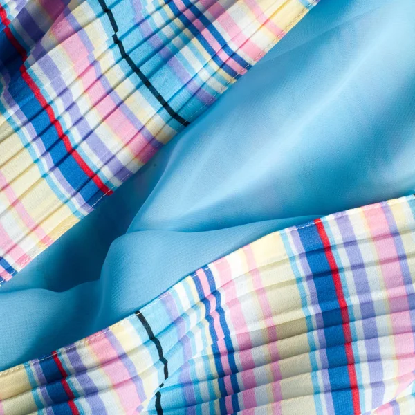 Pileli kumaş. Sinii sarı kırmızı beyaz çizgili doku. Fotoğraf stüdyosu