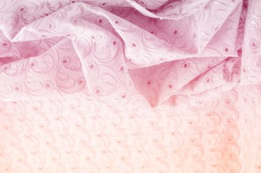 Doku arka planını kumaş. Bez delikli daireler ile. Kumaş dokusuna pastel tonlarda pembe renk, pembe pamuk bez doku arka planda pastel renkler close-up boyalı.