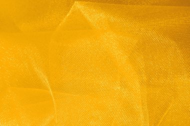 Doku, arka plan, desen. Sarı ipek kumaş. Pürüzsüz zarif altın ipek arka plan olarak kullanabilirsiniz. Altın saten Tekstil arka plan. 
