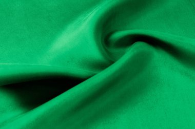 Arka plan doku, desen. Kalın kalın ipek kumaş yeşildir. Bu saten kumaş tasarımında bir pürüzsüz akışı oluşturmak için idealdir, bir sıvı örtüsü ve zarif Parlatıcı.