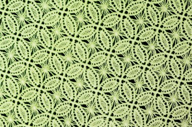Resmi doku arka planı, dekoratif dantel desenli. Yeşil vintage danteller arka plan. Yeşil dantel beyaz spandex arka planda, makro görünümü. Dekoratif yuvarlak dantel