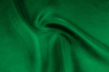 Arka plan doku, desen. Kalın kalın ipek kumaş yeşildir. Bu saten kumaş tasarımında bir pürüzsüz akışı oluşturmak için idealdir, bir sıvı örtüsü ve zarif Parlatıcı.