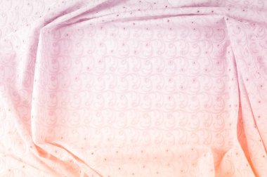 Doku arka planını kumaş. Bez delikli daireler ile. Kumaş dokusuna pastel tonlarda pembe renk, pembe pamuk bez doku arka planda pastel renkler close-up boyalı.
