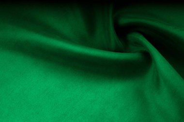 Arka plan doku, desen. Kalın kalın ipek kumaş yeşildir. Bu saten kumaş tasarımında bir pürüzsüz akışı oluşturmak için idealdir, bir sıvı örtüsü ve zarif Parlatıcı.
