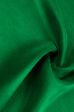 Arka plan doku, desen. Kalın kalın ipek kumaş yeşildir. Bu saten kumaş tasarımında bir pürüzsüz akışı oluşturmak için idealdir, bir sıvı örtüsü ve zarif Parlatıcı.