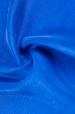 Arka plan doku, desen. Mavi renk kalın kalın ipek kumaş. Bu süper ağır ve çok yoğun polyester kumaş ile bina herhangi bir tasarım, lüks bir dokunuş eklemek.