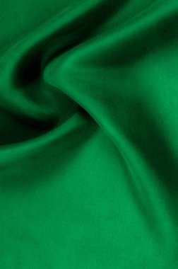 Arka plan doku, desen. Kalın kalın ipek kumaş yeşildir. Bu saten kumaş tasarımında bir pürüzsüz akışı oluşturmak için idealdir, bir sıvı örtüsü ve zarif Parlatıcı.