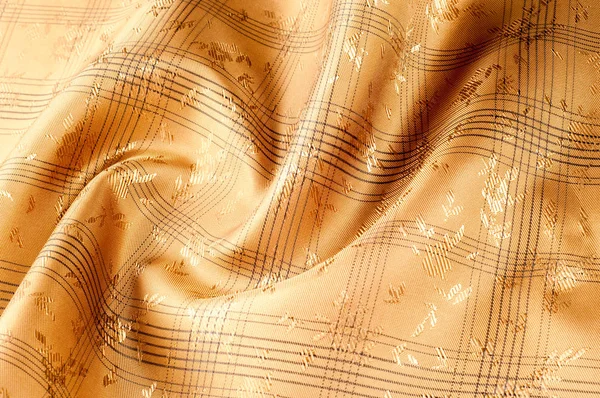 Texture background pattern. Silk fabric is brown, chocolate with milky color, carnelian, burnt sienna, flame, lust, persimmon, color. Abstract luxury fabric background or liquid waves or wavy grunge folds