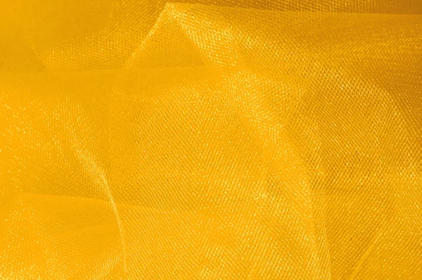 Doku, arka plan, desen. Sarı ipek kumaş. Pürüzsüz zarif altın ipek arka plan olarak kullanabilirsiniz. Altın saten Tekstil arka plan. 