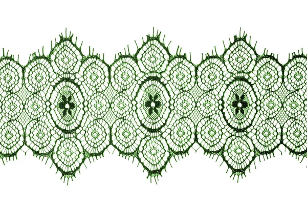 doku, arka plan, desen. dantel kumaş. yeşil. İşlemeli çiçekler açar her iki kenarları boyunca sınırında çarpıcı, süre düzensiz büyür saf tül ortasından.