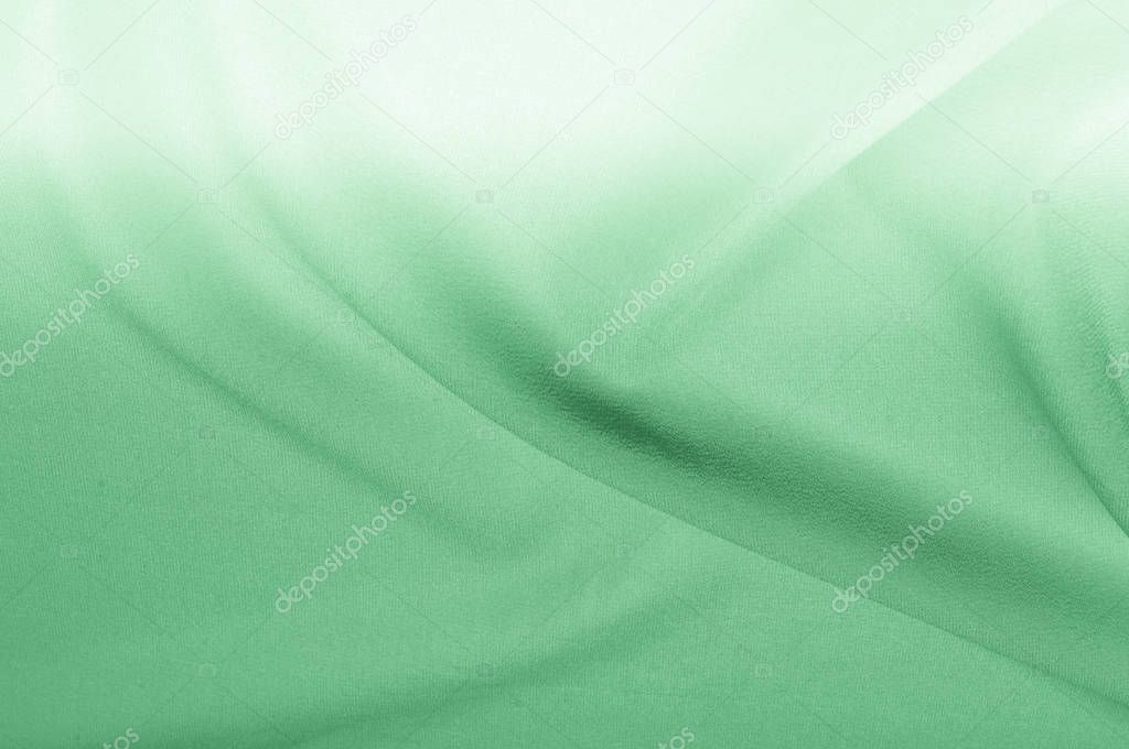 Background texture, pattern. silk fabric is green pale. At the top of the fashion dress up your decision in the latest design for your web page overlay layer outfits