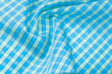 Arka plan doku, desen. ince pamuklu kumaş mavi ve bej bir kafeste. Yumuşak pamuklu - tasarım, dekorasyon, el sanatları için büyük,