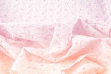 Doku arka planını kumaş. Bez delikli daireler ile. Kumaş dokusuna pastel tonlarda pembe renk, pembe pamuk bez doku arka planda pastel renkler close-up boyalı.