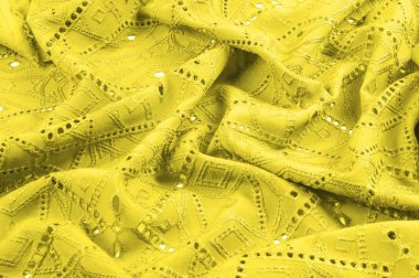 texture, pattern. Cloth is yellow dense with perforated holes. Perforated with a delightful design, ripe for conversation. Providing an extremely soft surface texture along with flexible drapery, clipart