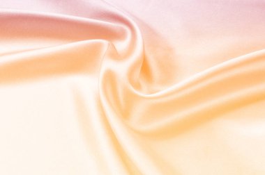 Kumaş arka plan doku. Kırmızı Sarı kapşonlu bej ipek kumaş. Doku yazıtlar için. Lüks kumaşlar veya sıvı dalgalar bir arka plan veya dalgalı kıvrımları gibi grunge parçası 