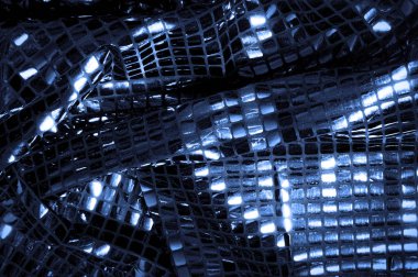 doku, arka plan, desen. Kumaş ile mavi renk büyük parıldıyor. Bu tek tük parıldıyor ile bazı tarzı göstermek! Polyester örgü yüzey üzerinde dağınık, mavi ve beyaz pullu vardır,