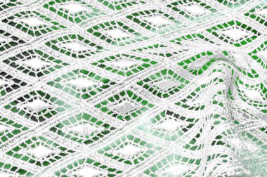 Doku arka plan deseni. Dantelli beyaz kumaş. Beyaz arka plan üzerinde el dantel. Beyaz guipure, nakış kumaş bir gelinlik, kartpostal, fotoğraf duvar kağıtları, afiş için,