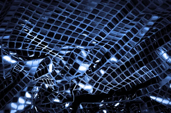 doku, arka plan, desen. Kumaş ile mavi renk büyük parıldıyor. Bu tek tük parıldıyor ile bazı tarzı göstermek! Polyester örgü yüzey üzerinde dağınık, mavi ve beyaz pullu vardır,