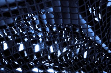 doku, arka plan, desen. Kumaş ile mavi renk büyük parıldıyor. Bu tek tük parıldıyor ile bazı tarzı göstermek! Polyester örgü yüzey üzerinde dağınık, mavi ve beyaz pullu vardır,