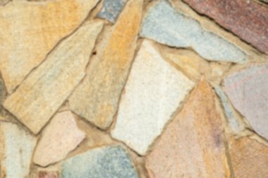 Arka plan doku bulanık Granit taş çit içinde karmaşık. Taş duvar, arka plaka. Duvar doku soyut granit