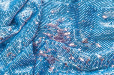 Doku, arka plan, desen. İpek kumaş ile payetler işlemeli mavi rengini sparkles yansıtan güneş ışınlarının