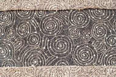 Doku, kumaş, arka plan. Altın iplik iplik ile bir daire desenli dantel kumaş
