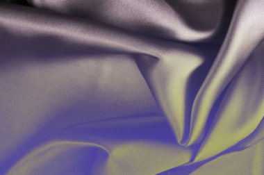 Kumaş arka plan doku. Gri mavi ipek kumaş. Doku yazıtlar için. Lüks kumaşlar veya sıvı dalgalar bir arka plan veya dalgalı kıvrımları gibi ipek saten malzemeden grunge doku parçası