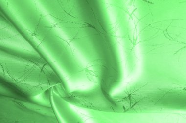 Yumuşak odak arka plan doku, desen. İpek kumaş satırları bir desenle yeşildir. Bu yeşil ipek krep de Çin, fanasium şarj etmek için işte! İnce bir Parlatıcı olduğunu