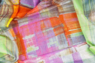 Doku arka plan deseni. İpek ince kumaş, beyaz, yeşil, kırmızı, pembe ve sarı kareler soyut desen. resimde. İnce çizgi çizme. arka plan deseni, oryantal tarzda.