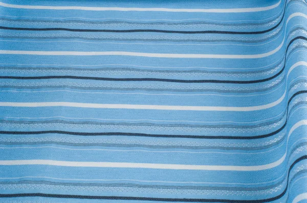 Texture, background, pattern. Woolen fabric is blue, striped. Outdoor family travel and vacation wallpaper with a checkered pattern pattern. Blue and white fabric fabric lines.