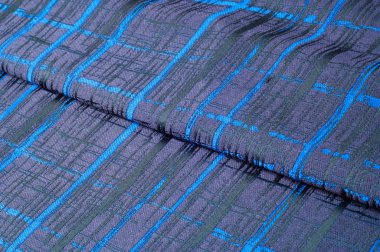 Doku, kumaş, arka plan. Yünlü kumaş. Koyu mavi çizgili. Siyah şeritler