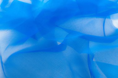 Yumuşak odak. doku, desen. Kumaş mavidir. ipek kumaş saydamdır. Bu tüm tasarım stüdyoları için çok önemlidir. Bu bitiş polyester mesh ve herhangi bir giysi, esnek bir türüdür.