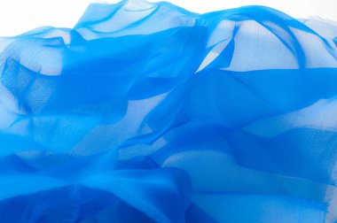 Yumuşak odak. doku, desen. Kumaş mavidir. ipek kumaş saydamdır. Bu tüm tasarım stüdyoları için çok önemlidir. Bu bitiş polyester mesh ve herhangi bir giysi, esnek bir türüdür.