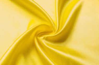 Doku arka plan deseni. İpek kumaş, sarı kumaş. Siyah bir arka plan üzerinde. Çiçek Tekstil veya kumaş. Kumaş dokusuna. Kumaş, tekstil, kumaş, dokuma malzeme,.