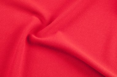 Doku, arka plan, desen. Kırmızı kumaş. Kırmızı arka plan. Kırmızı soyut kumaş arka plan ya da sıvı dalgalar dalgalı ipek kıvrımlar çizimi