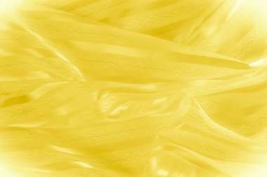 Arka plan doku, desen. Hafif bir şerit ile sarı ipek kumaş. Sarımsı doku. Pürüzsüz zarif sarı saten arka plan.