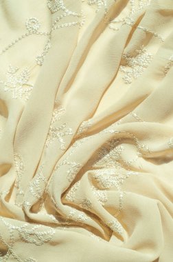 Doku, arka plan, desen. Kadın renk şal. Altın Başak. Limon kremalı. Navajo beyazdır. Eski altın. ipek kumaş.