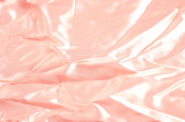 Doku, arka plan, desen. Kumaş ipek pembe arka plan. Güzel pembe saten. Perdelik arka plan. rüzgarlar dalgalar, kıvrımları güzel bir arka plan oluşturma.