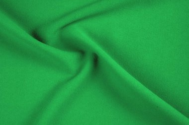 Doku, arka plan, desen. Yeşil, salata renkli ipek kumaş. Yeşil kumaş dokusu. Yeşil kumaş doku ve arka plan görünümünü kapatın. Arka plan ve doku tasarımcılar için.