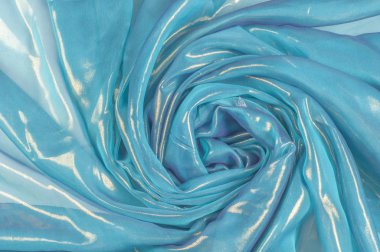 Doku, arka plan, desen. İpek kumaş mavi, ince havadar ipek kumaş, kumaş güneş ışınlarının yansıtır.