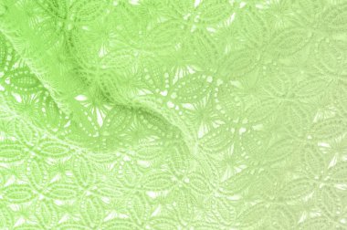 Resmi doku arka planı, dekoratif dantel desenli. Yeşil vintage danteller arka plan. Yeşil dantel beyaz spandex arka planda, makro görünümü. Dekoratif yuvarlak dantel