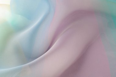 Doku, arka plan, desen. İpek kumaş şeffaf, sarı-pembe yeşil mavi olduğunu. Soyut yumuşak şifon doku arka plan. 