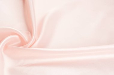 Doku, arka plan, desen. Kumaş ipek pembe arka plan. Güzel pembe saten. Perdelik arka plan. rüzgarlar dalgalar, kıvrımları güzel bir arka plan oluşturma.