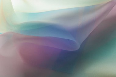 Doku, arka plan, desen. İpek kumaş şeffaf, sarı-pembe yeşil mavi olduğunu. Soyut yumuşak şifon doku arka plan. 