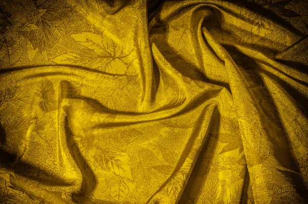 Texture background cloth silk yellow With an elegant shine this beautiful material will bring generosity in any applications With such a crispy drapery this satin necessarily adds to any design