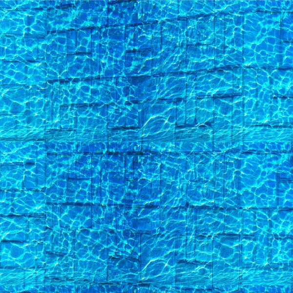 Texture, background, pattern. Pool hotel with sunny reflections. Background of a rippled picture of clean water in a blue pool. Natural screening of water from sandstone in the pool.