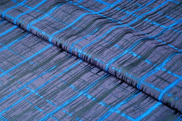 Doku, kumaş, arka plan. Yünlü kumaş. Koyu mavi çizgili. Siyah şeritler