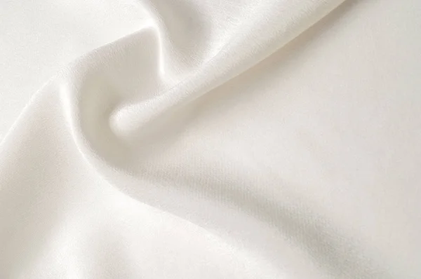 纹理背景图案 白色丝绸织品 一个波纹的白色丝绸面料特写 广告空间 光滑优雅的白色丝绸可以作为婚礼的背景 — 图库照片